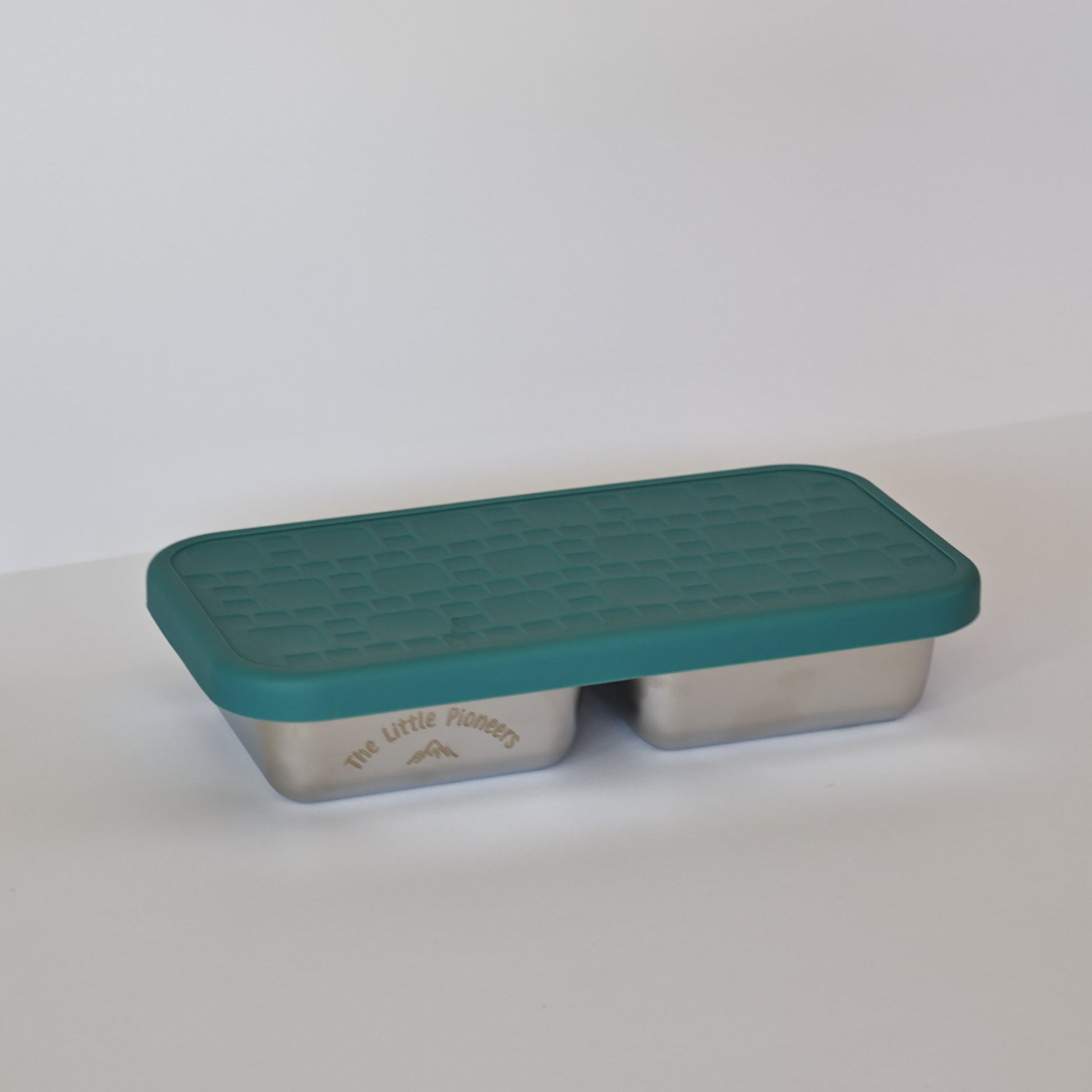 Rectangular metal container with a green lid on a white background