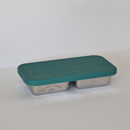 Rectangular metal container with a green lid on a white background